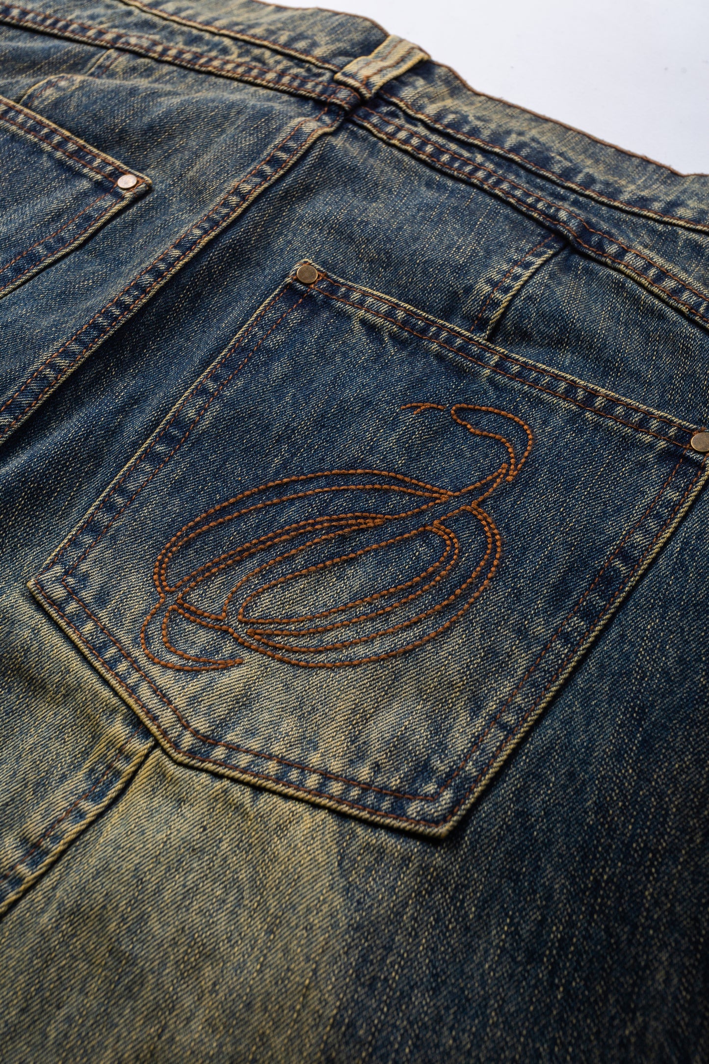 Cursive Washed Denim Jeans