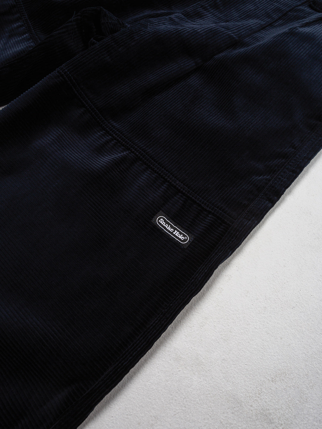 Gridline Pleated Corduroy Trousers